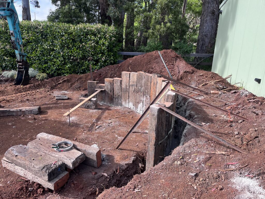 Sleeper retaining wall under construction