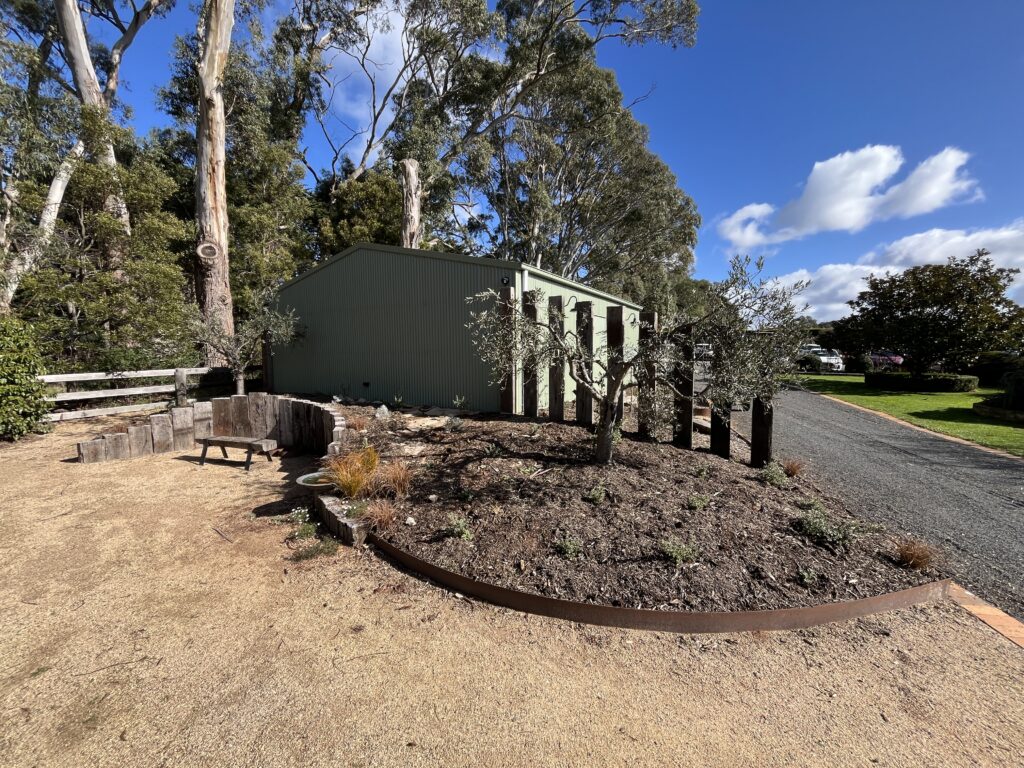 Completed curved sleeper retaining wall